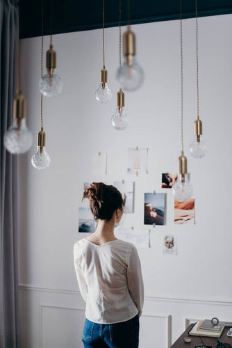 lady looking at her vision board
