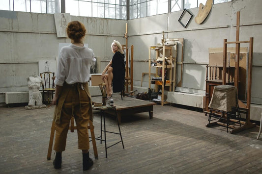 Creative entrepreneur painting in a studio