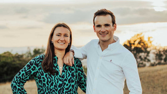 Ollie and Clare, OCCO London's co-founders, together in warm outdoor light