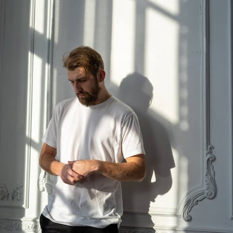 Person sitting at a desk looking mentally exhausted and unable to concentrate, representing the cognitive fog associated with depression
