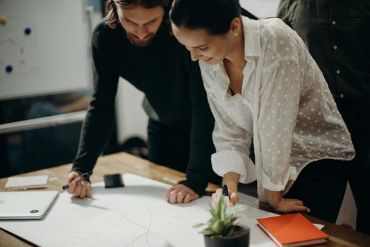Creative colleagues working in the creative process to outline a design