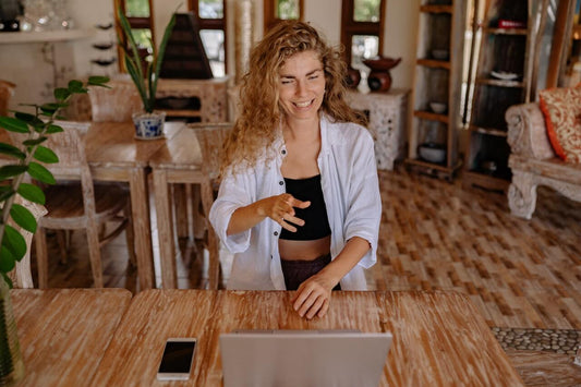 Creative female working at her desk having used affirmations for confidence