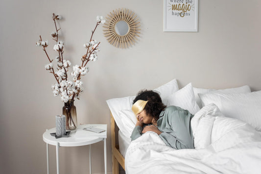 Creative lady with a face mask on getting enough sleep