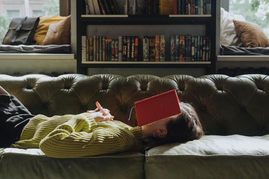 Emotionally exhausted creative lady lying on the sofa