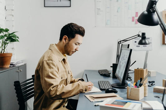 creative entrepreneur with ADHD working at his desk