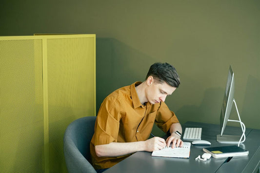 Creative man thinking about his vision board