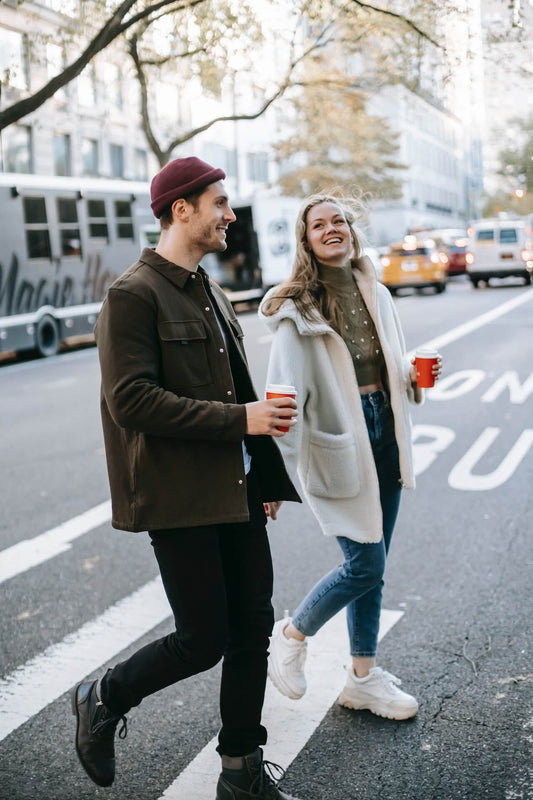 creative couple talking a walk in town