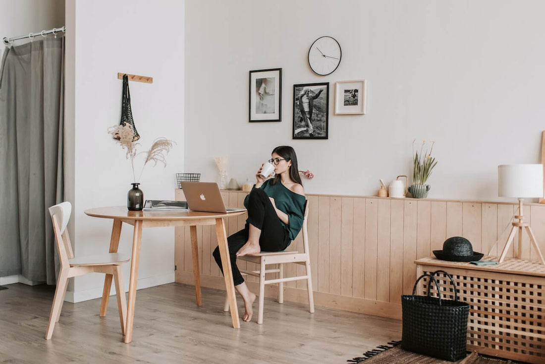 woman relaxing at home writing a values-based reflection rather than reciting affirmations