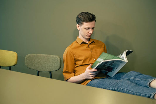 creative man priotising himself reading a book