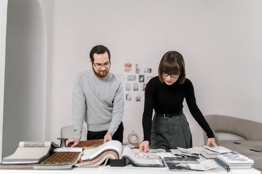 introvert and extrovert looking at design work on a table