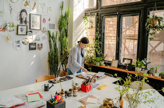 lady planning her vision board in her studio