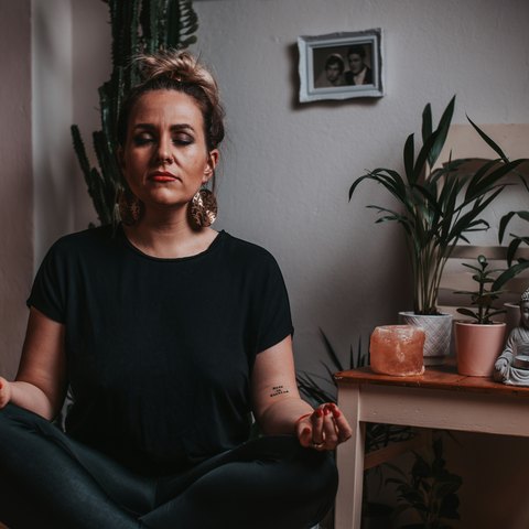 Person in a quiet reflective moment, representing the experience of relationship overthinking