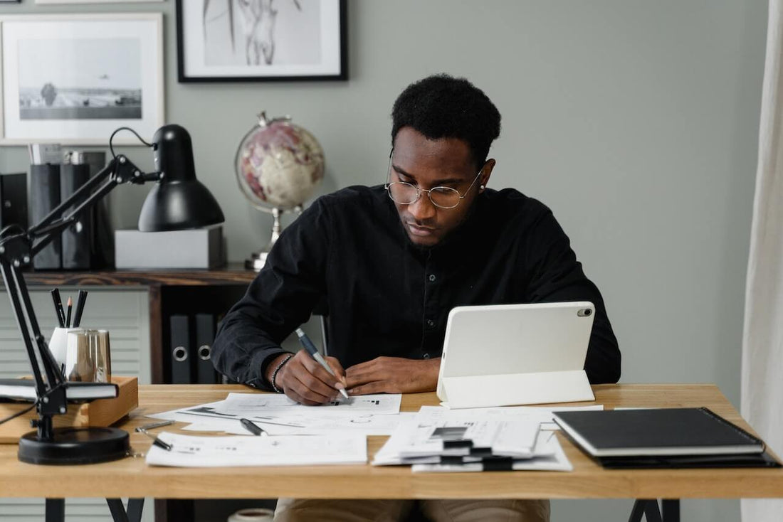 male creative entrepreneur reviewing productivty vs performance metrics