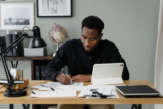 male creative entrepreneur reviewing productivty vs performance metrics