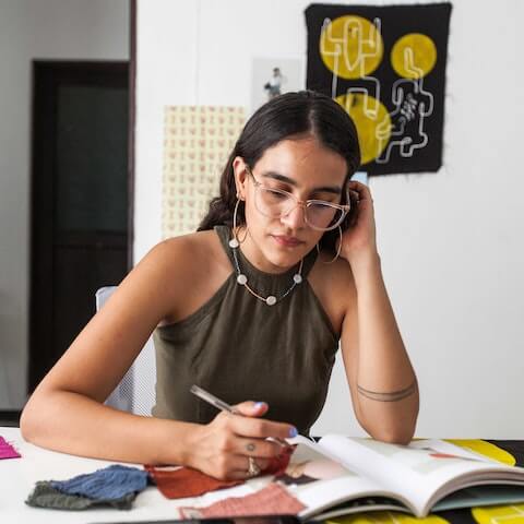 Multipassionate creative entrepreneur working at her desk