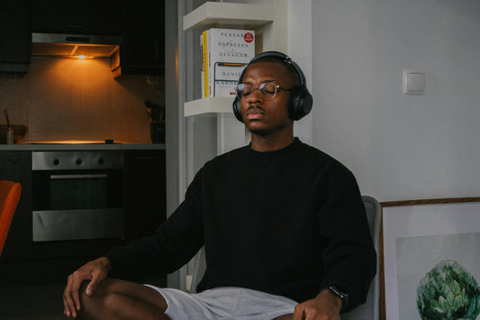 Man sitting quietly at home on a Sunday morning, contemplative before the week ahead