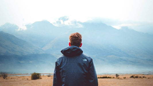 Individual sitting alone in a calm space, recognising the signs of social burnout