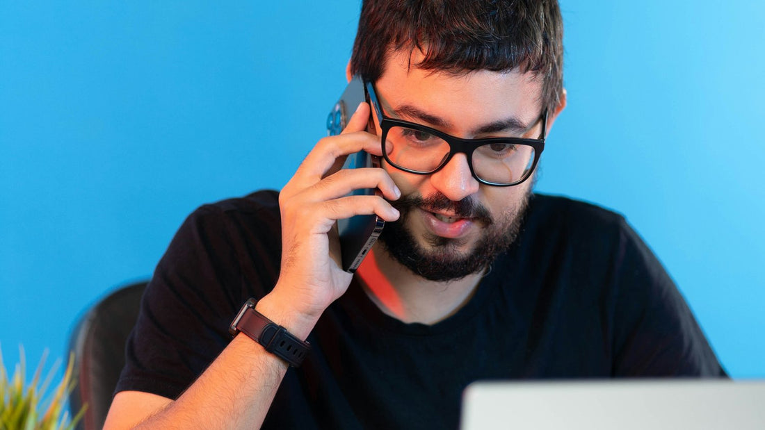 Stressed man at a laptop looking exhausted, worn down by decision fatigue
