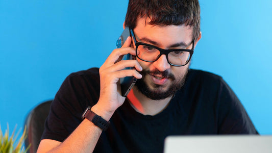 Stressed man at a laptop looking exhausted, worn down by decision fatigue