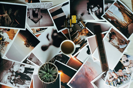 Vision board with images and words pinned up, representing specific goals someone is visualising