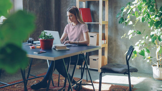 Person writing a novel in a short, consistent daily session around a full-time job