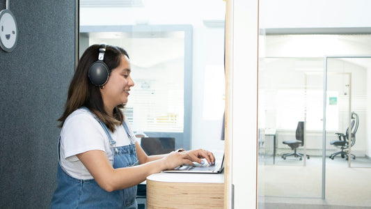 Diverse group working together in a warm coworking space, following through on a shared plan